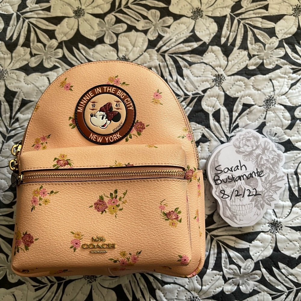 Pink floral Coach Minnie Mouse mini backpack